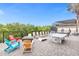 Game area with ping pong table, cornhole, and lounge chairs at 494 Muirfield Loop, Reunion, FL 34747