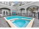 Inviting swimming pool with spa and safety fence at 494 Muirfield Loop, Reunion, FL 34747
