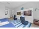 Bedroom with two twin beds and large TV at 494 Muirfield Loop, Reunion, FL 34747