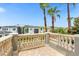 Private balcony with stone balustrades and neighborhood views at 494 Muirfield Loop, Reunion, FL 34747