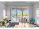 Open living area with sliding glass doors revealing a view of the pool and patio at 494 Muirfield Loop, Reunion, FL 34747