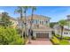 Beautiful two-story home with tile roof and attached garage at 494 Muirfield Loop, Reunion, FL 34747