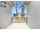 Private balcony overlooking palm trees and neighborhood at 494 Muirfield Loop, Reunion, FL 34747