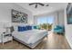 King bedroom with private balcony and tranquil views at 494 Muirfield Loop, Reunion, FL 34747