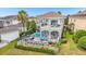 Luxury home with private pool, patio, and ping pong table at 494 Muirfield Loop, Reunion, FL 34747