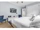 Main bedroom with king bed and TV, offering comfort and entertainment at 494 Muirfield Loop, Reunion, FL 34747