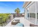 Private balcony offering scenic views and relaxing seating at 494 Muirfield Loop, Reunion, FL 34747