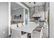 Outdoor kitchen with stainless steel appliances and dining area at 494 Muirfield Loop, Reunion, FL 34747