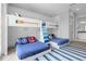 Bedroom with twin bunk beds and nautical theme at 494 Muirfield Loop, Reunion, FL 34747