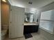 Clean bathroom with single vanity, shower, and toilet at 701 Virtuoso Ln # 81, Orlando, FL 32824
