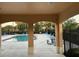 Community pool with lounge chairs and tables at 701 Virtuoso Ln # 81, Orlando, FL 32824