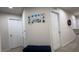 Home hallway with two closets and a bench at 701 Virtuoso Ln # 81, Orlando, FL 32824