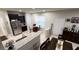 Open concept kitchen with granite countertops and a breakfast bar at 701 Virtuoso Ln # 81, Orlando, FL 32824