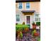 Inviting house exterior featuring a well-manicured lawn and attractive landscaping at 701 Virtuoso Ln # 81, Orlando, FL 32824