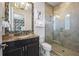 Modern bathroom with granite countertop and glass shower at 1125 Grand Traverse Pkwy, Reunion, FL 34747