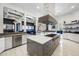 Modern kitchen with a large island, stainless steel appliances, and ample counter space at 1125 Grand Traverse Pkwy, Reunion, FL 34747