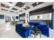 Living area with blue velvet sofas and coffered ceiling at 1125 Grand Traverse Pkwy, Reunion, FL 34747