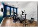 Home gym featuring state-of-the-art equipment and stylish wall accents at 1125 Grand Traverse Pkwy, Reunion, FL 34747
