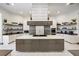 Modern kitchen with a large island, stainless steel appliances, and ample counter space at 1125 Grand Traverse Pkwy, Reunion, FL 34747