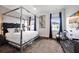 Luxurious bedroom with a four poster bed and modern decor at 1125 Grand Traverse Pkwy, Reunion, FL 34747