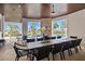 Outdoor kitchen with stainless steel appliances and seating area at 1125 Grand Traverse Pkwy, Reunion, FL 34747