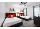 Guest bedroom with two beds and colorful accents at 1125 Grand Traverse Pkwy, Reunion, FL 34747