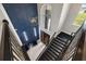 Bright entryway with a statement wall and modern light fixture at 1125 Grand Traverse Pkwy, Reunion, FL 34747