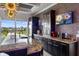 Gourmet kitchen with granite countertops and stainless steel appliances at 1125 Grand Traverse Pkwy, Reunion, FL 34747