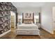 Guest bedroom with a comfortable queen-size bed and closet at 1125 Grand Traverse Pkwy, Reunion, FL 34747