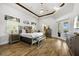 Spacious Primary bedroom with a king-size bed and access to a patio at 1125 Grand Traverse Pkwy, Reunion, FL 34747