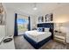 Serene bedroom with a navy blue upholstered bed at 1125 Grand Traverse Pkwy, Reunion, FL 34747