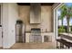 Stainless steel outdoor kitchen with built-in grill and sink at 1125 Grand Traverse Pkwy, Reunion, FL 34747