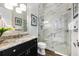 Elegant bathroom with granite vanity, large shower, and modern fixtures at 1125 Grand Traverse Pkwy, Reunion, FL 34747
