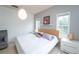 Main bedroom with king-size bed and large windows at 3593 Conroy Rd # 437, Orlando, FL 32839