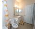 Bathroom with shower, toilet and a white vanity at 3593 Conroy Rd # 437, Orlando, FL 32839
