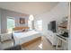 Main bedroom with a king-size bed and plenty of light at 3593 Conroy Rd # 437, Orlando, FL 32839