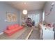 Fun playroom featuring a coral couch and toys at 3593 Conroy Rd # 437, Orlando, FL 32839