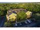 Aerial view of yellow three-story building and parking at 3593 Conroy Rd # 437, Orlando, FL 32839