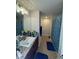 Bathroom with a shower/tub combo and double vanity at 2513 Rock Pl, Kissimmee, FL 34759
