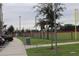 View of a park with baseball field, parking lot, and walking path at 2513 Rock Pl, Kissimmee, FL 34759