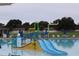 Community pool with water features and a play area at 2513 Rock Pl, Kissimmee, FL 34759
