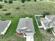 Single-story house, large backyard, and neighborhood view at 2513 Rock Pl, Kissimmee, FL 34759