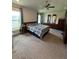 Main bedroom with a king-size bed and ensuite bathroom at 2513 Rock Pl, Kissimmee, FL 34759