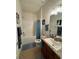 Bathroom with tub, shower, and granite countertop vanity at 2513 Rock Pl, Kissimmee, FL 34759