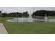 Serene community pond with water fountain and lush landscaping at 2513 Rock Pl, Kissimmee, FL 34759