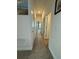 Long hallway with doors to bedrooms and bathrooms at 2513 Rock Pl, Kissimmee, FL 34759