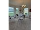 Cozy living area with rocking chairs and large windows at 2513 Rock Pl, Kissimmee, FL 34759