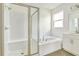 Bathroom with shower and separate tub at 176 Flag Lilly Ln, Umatilla, FL 32784