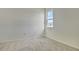 Simple bedroom with neutral wall paint and carpeting at 176 Flag Lilly Ln, Umatilla, FL 32784