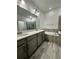 Double vanity bathroom with a soaking tub and shower at 12351 Northover Loop, Orlando, FL 32824